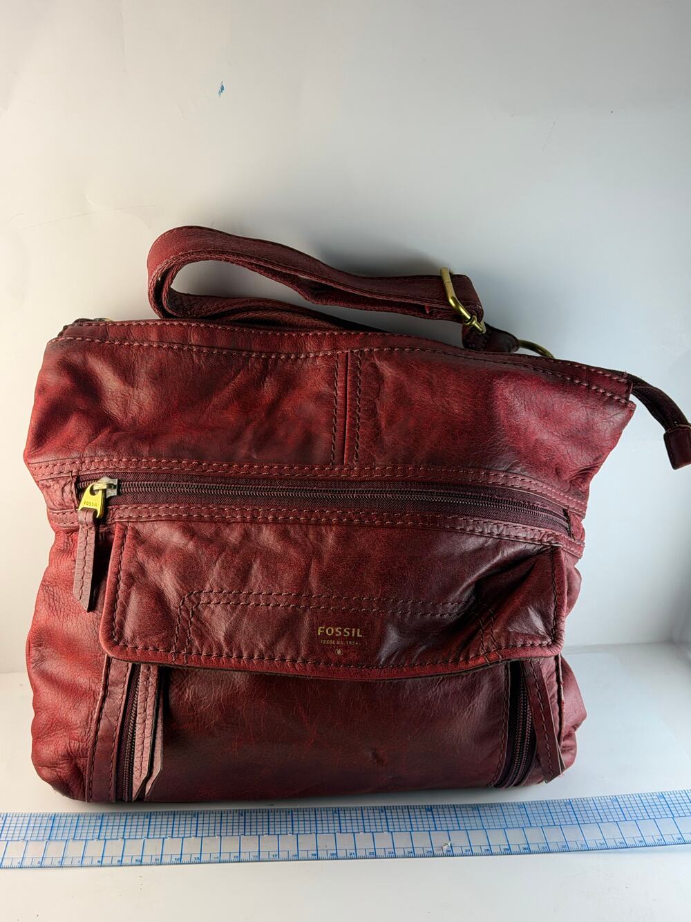 Fossil burgundy leather shoulder bag with front flap pocket and zipper compartme